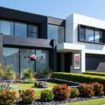 A futuristic Sydney neighborhood in 2026, showcasing a sleek and modern home exterior with a meticulously manicured garden.