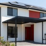 Modern Sydney home with smart energy-efficient upgrades including solar panels, LED lighting, and efficient plumbing systems to reduce energy bills Sydney