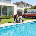 Professional AIM LOCAL service van at Sydney pool maintenance site with licensed plumber servicing pool equipment in residential backyard