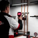 Sydney water bill investigation showing professional plumber using thermal imaging and acoustic leak detection equipment to find hidden water leaks in residential property