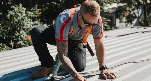 Professional roofing experts installing high-quality gutter systems for commercial buildings across Sydney