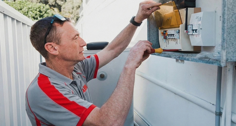Professional electrician installing advanced surge protection solutions for homes and businesses across Sydney