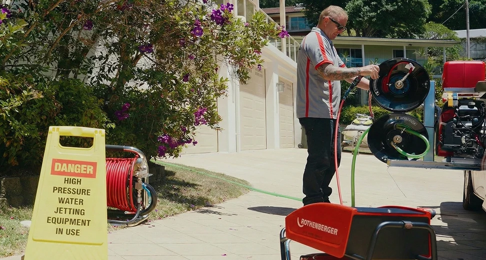 Experienced Sydney plumber inspecting and repairing underground sewer line systems for long-term performance