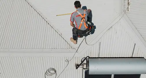 Experienced Sydney roofing specialist inspecting residential roofs to identify damage, wear and maintenance requirements